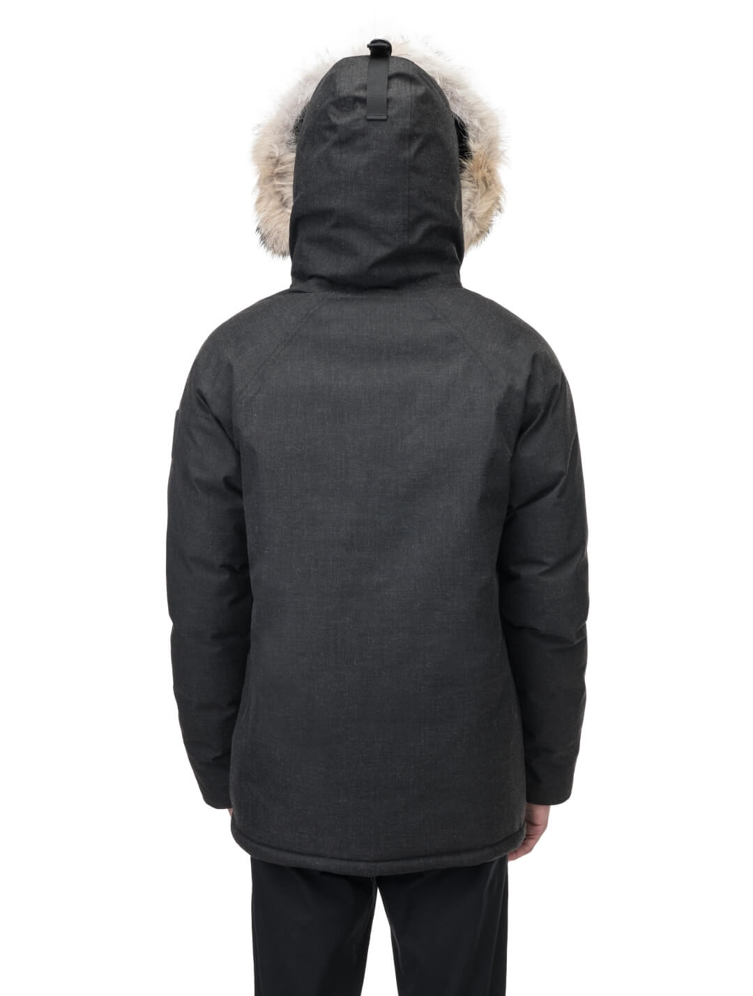 Duncan Keith Heritage Men's Parka in hip length, and features Canadian duck down insulation, non-removable hood with removable coyote fur trim, fleece-lined chest pockets, top and side entry waist pockets, adjustable waist cord, interior zipper pocket, and co-branding with Keith's signature on the left outer waist pocket, in H. Black