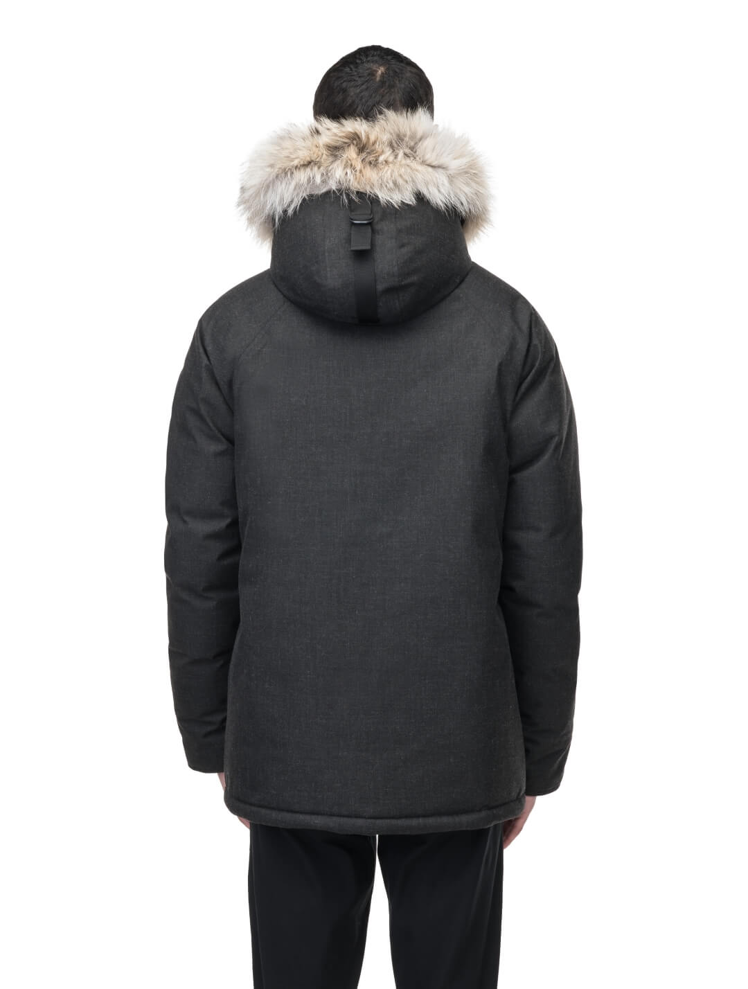 Duncan Keith Heritage Men's Parka in hip length, and features Canadian duck down insulation, non-removable hood with removable coyote fur trim, fleece-lined chest pockets, top and side entry waist pockets, adjustable waist cord, interior zipper pocket, and co-branding with Keith's signature on the left outer waist pocket, in H. Black