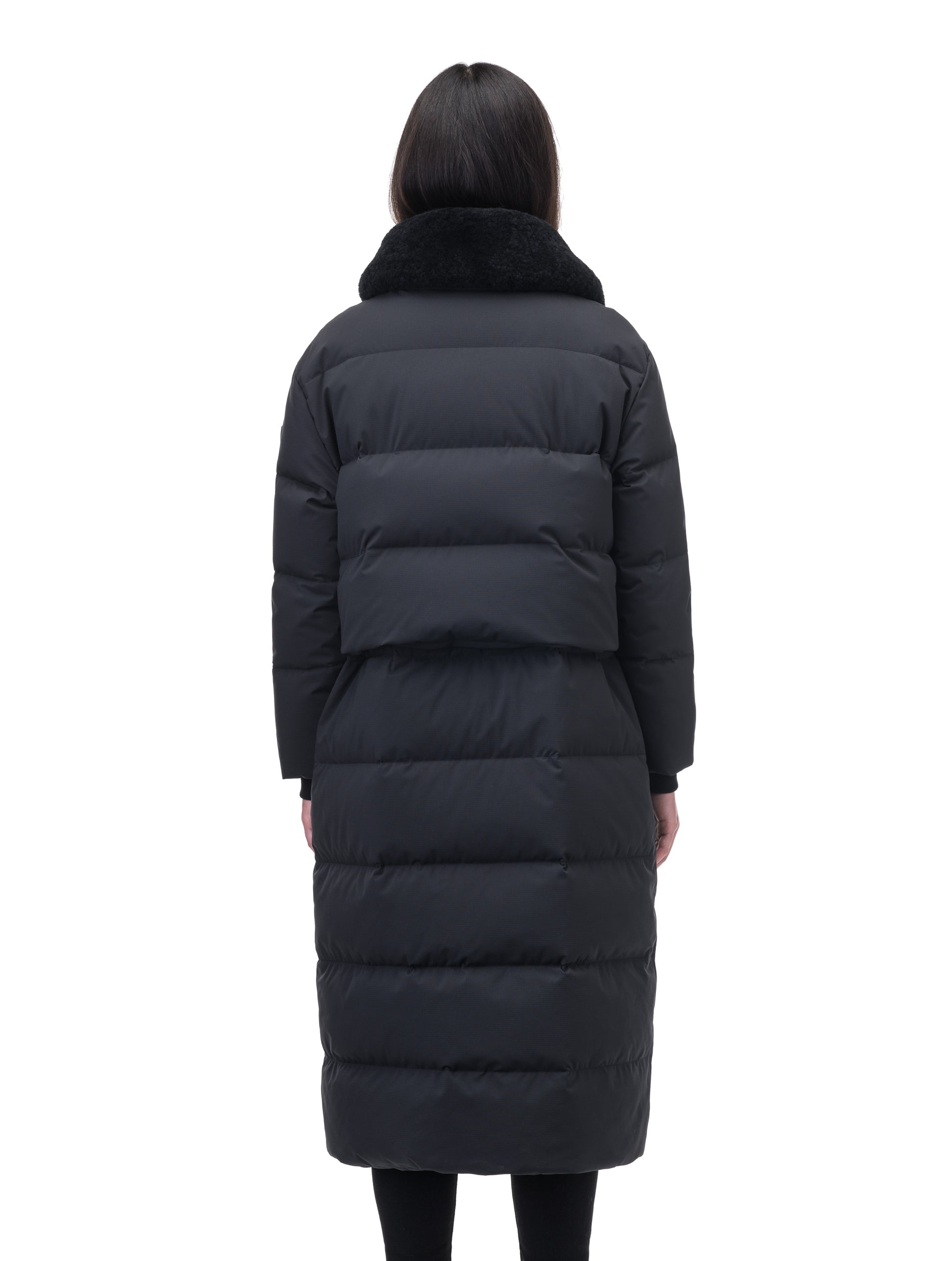Forma Ladies 2-in-1 Long Quilted Jacket in below the knee length, quilted body, soft ribbed cuffs, removable shearling collar and pockets, and removable cinchable skirt, in Black