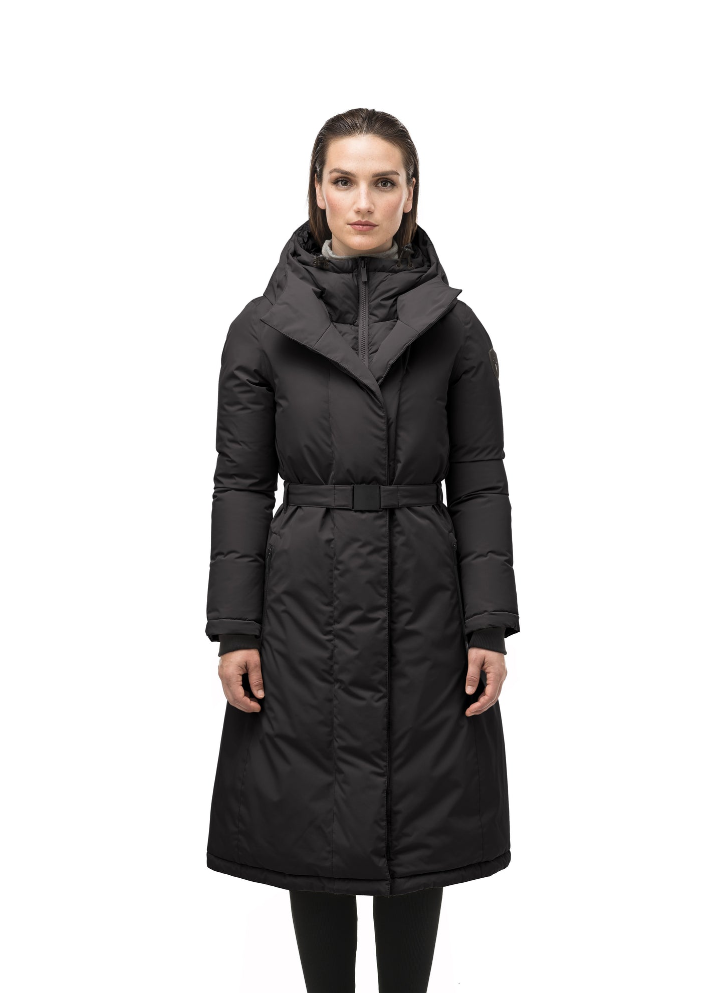 Long calf length hooded women's winter parka with an inner hip length closure, exterior hem length zipper and magentic placket in Black