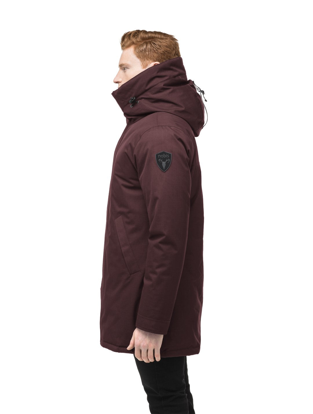 Pierre Men's Jacket in thigh length, Canadian white duck down insulation, non-removable down-filled hood, angled waist pockets, centre-front zipper with wind flap, and elastic ribbed cuffs, in CH Merlot