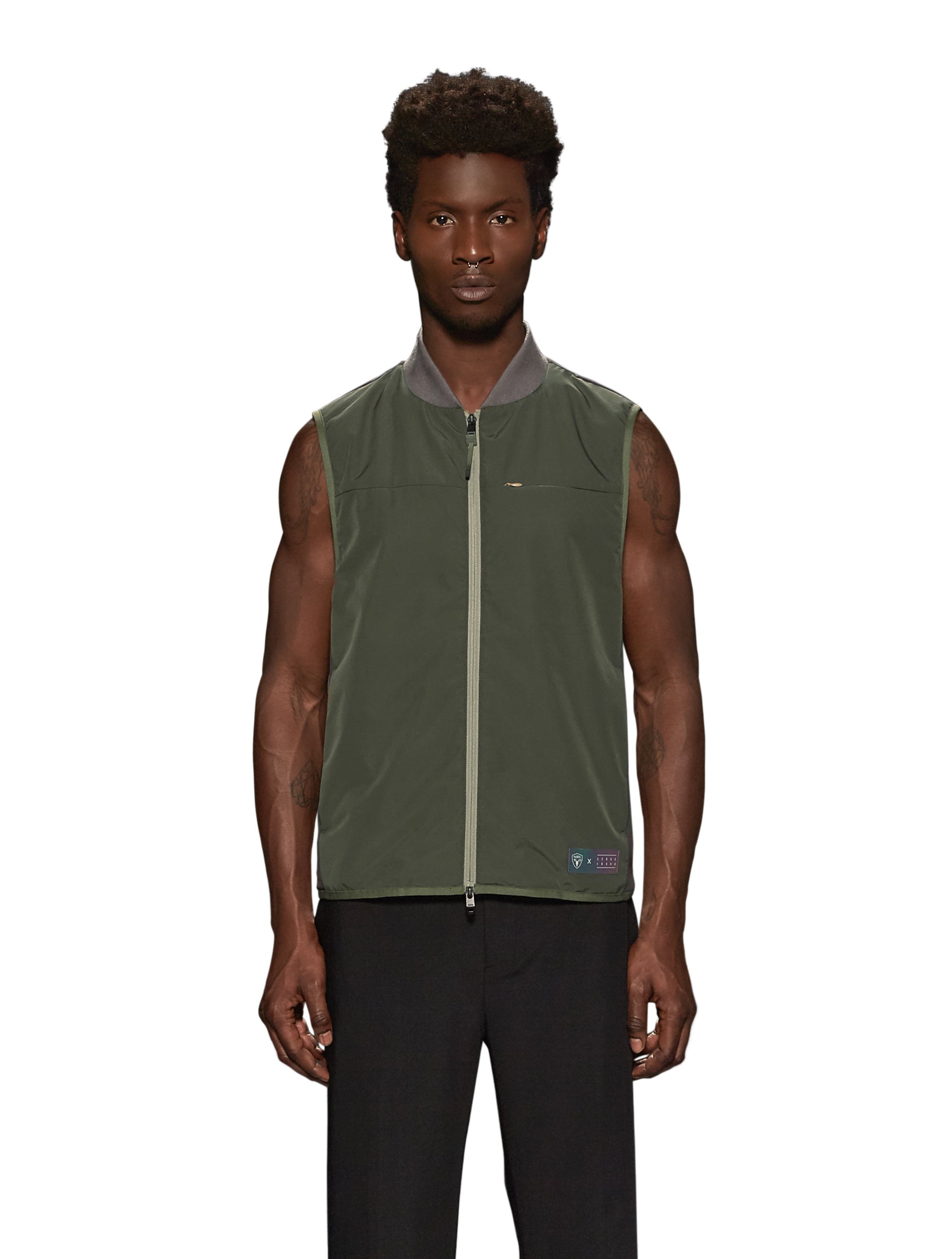 Unisex hip length vest with a contrast colour back panel, and hidden zipper pockets at waist, and an invisible zipper pocket at chest, in Fatigue/Licorice