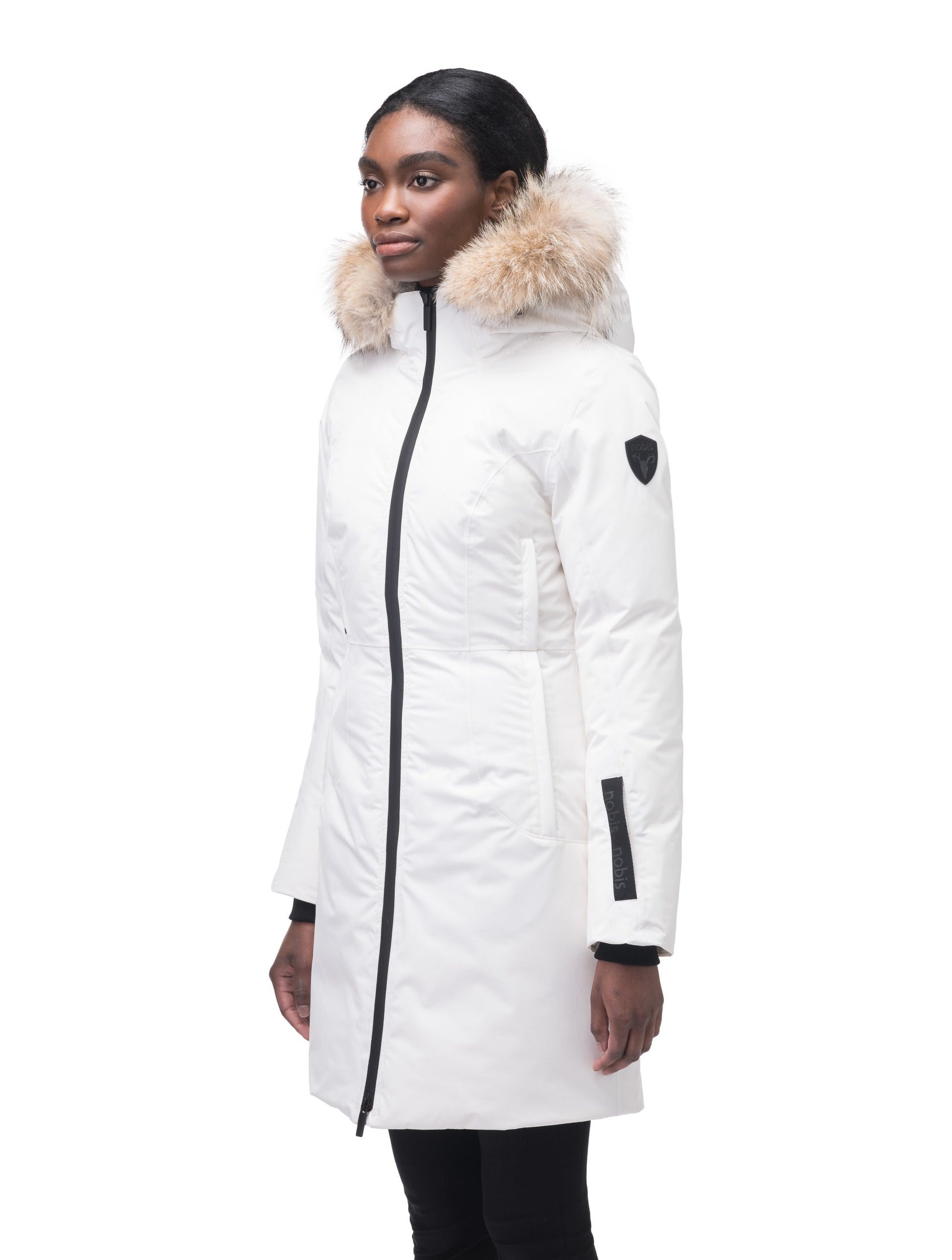 Ladies thigh length down-filled parka with non-removable hood and removable coyote fur trim in Chalk