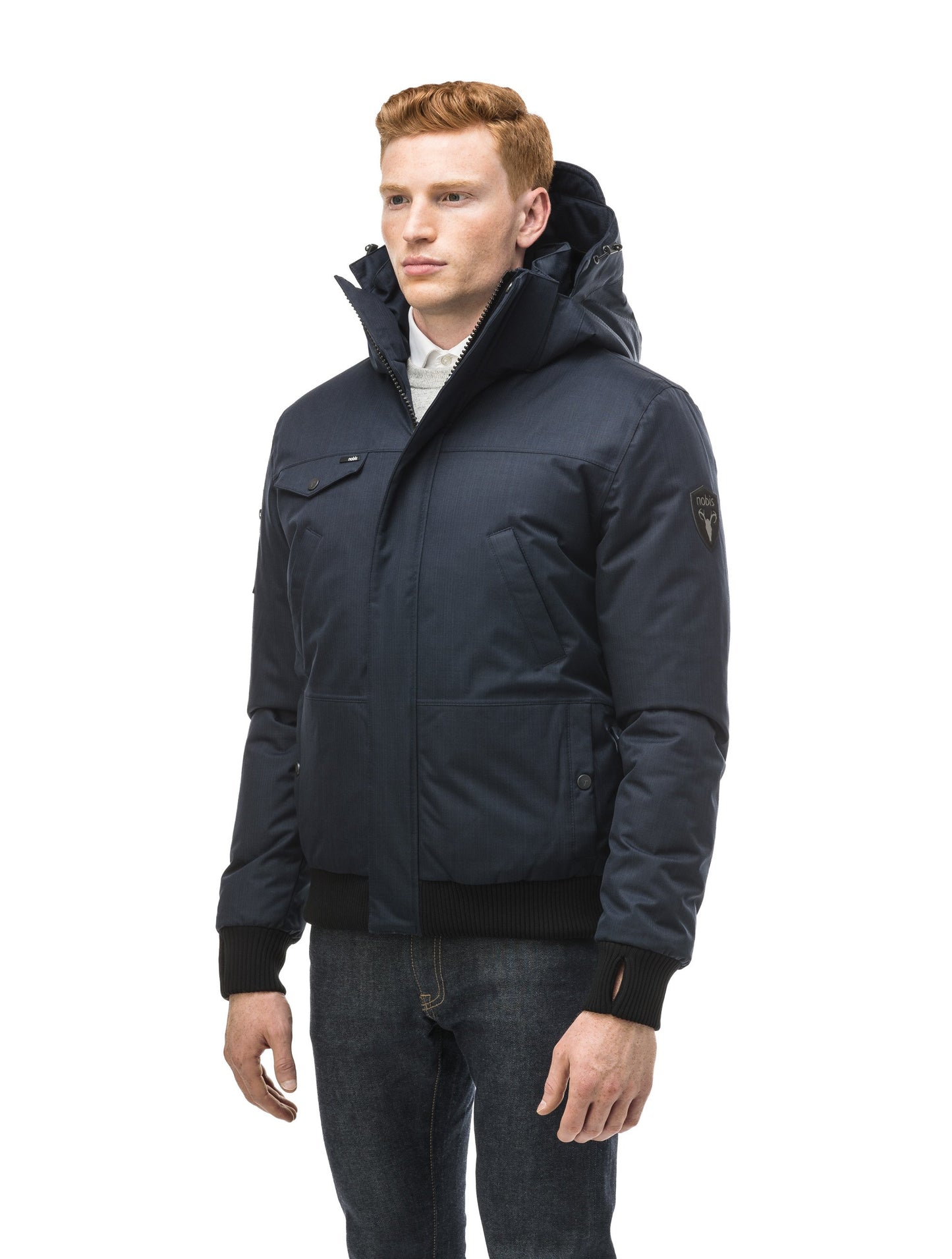 Men's sleek down filled bomber jacket with clean details and a fur free hood in CH Navy