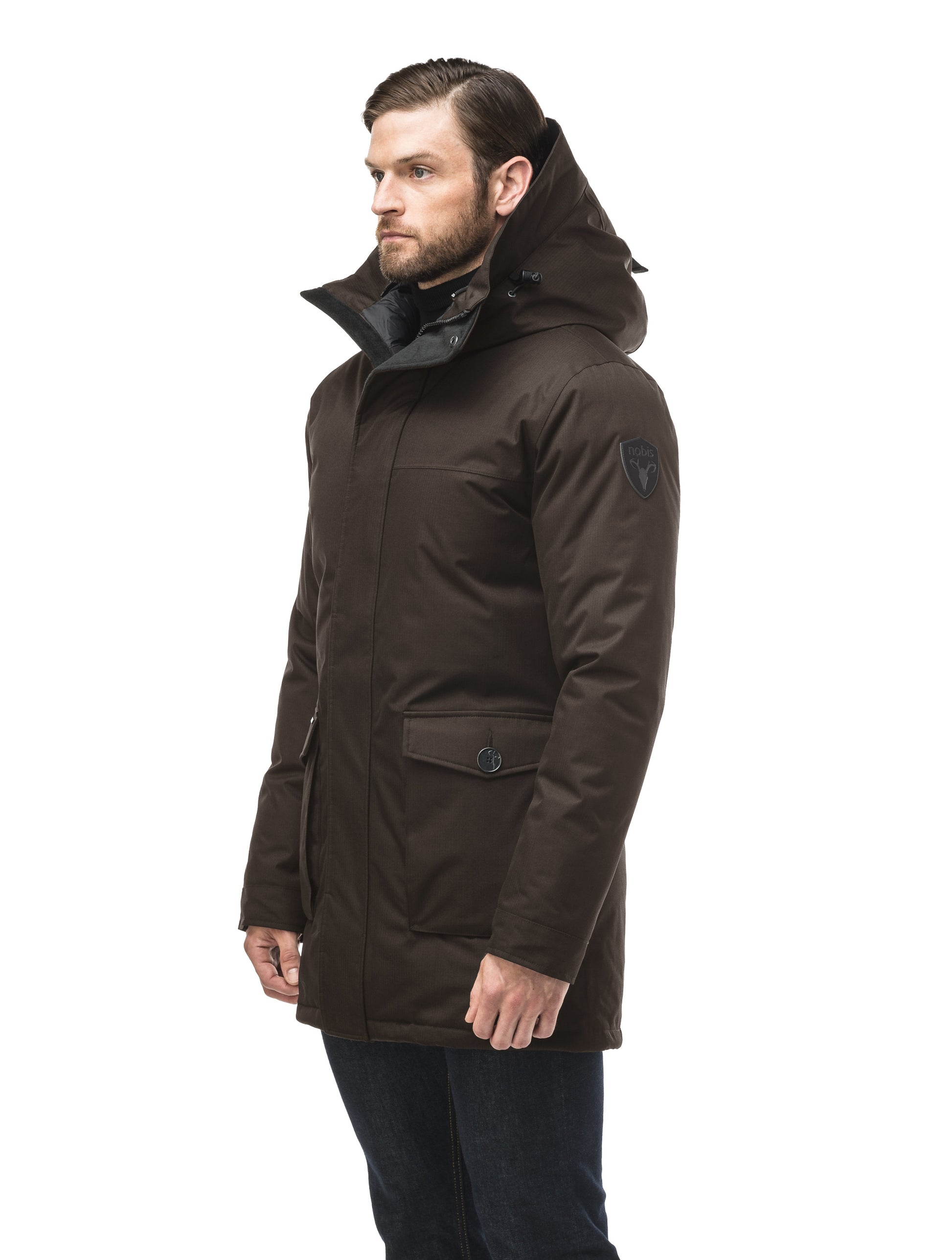 Men's slim fitting waist length parka with removable fur trim on the hood and two waist patch pockets in CH Brown